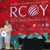 Lucy Torres-Gomez, a Filipino politician, stands on the podium to deliver her message for RCOY